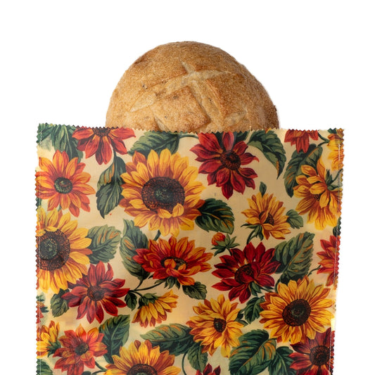 Floral-patterned bread bag with a loaf of bread on a white background
